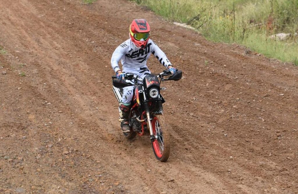 Rider riding a dirt bike motorcycle